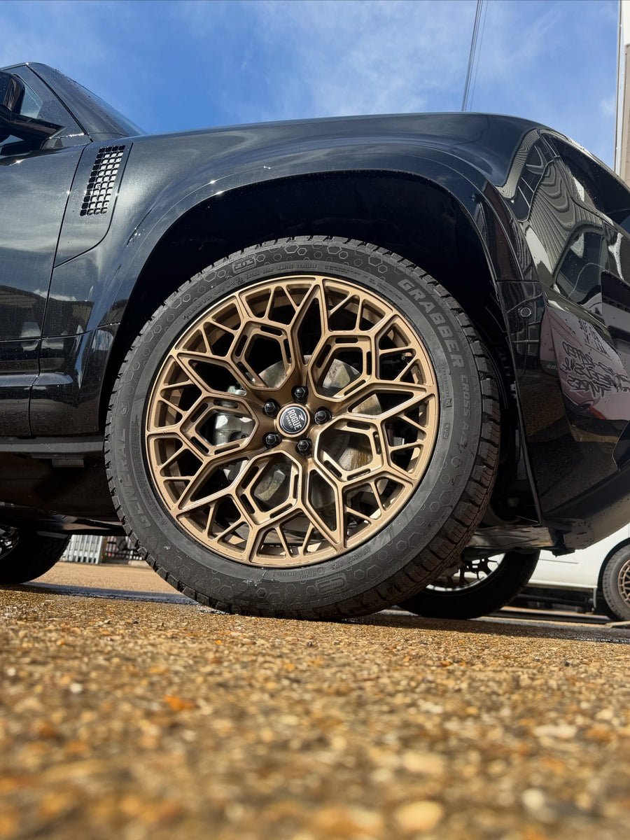 Bronze Rogue Rozi wheel with tyre fitted on a black pickup