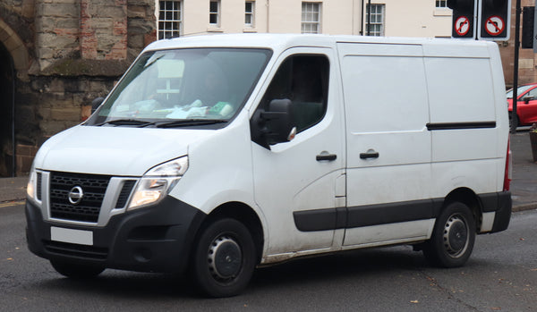 Front three-quarter view of a 2016 Nissan NV400 panel van on factory wheels